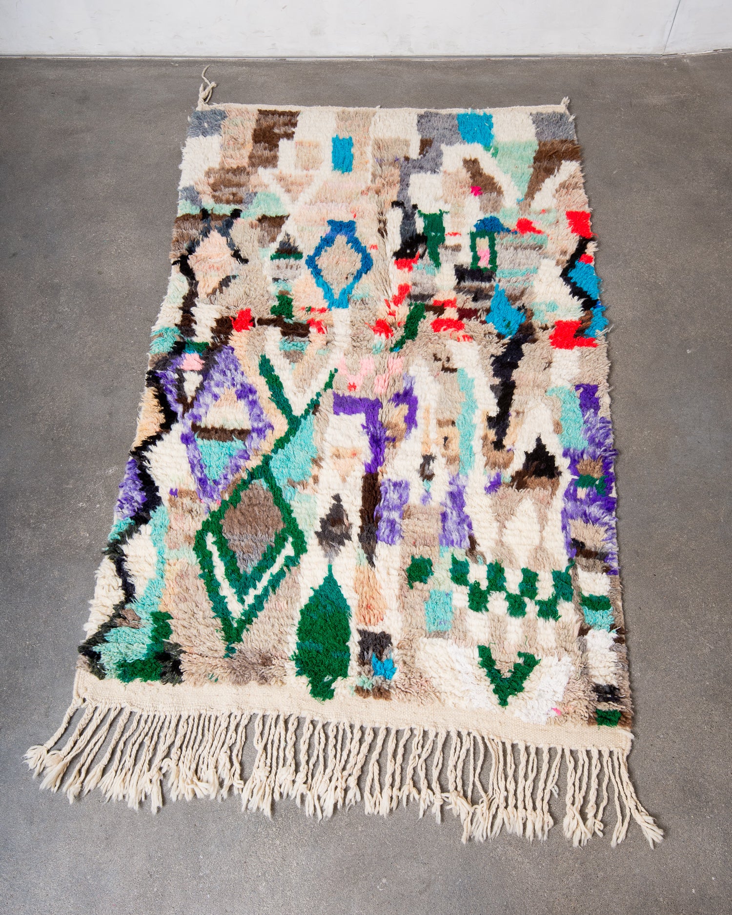 Modern, designer, handcrafted Berber rug from Morocco. Vintage carpet with beautiful colours and patterns and fluffy texture.
